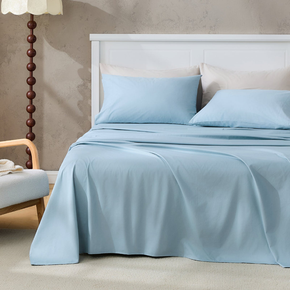 Litanika 100% cotton percale bedding sheet set with smooth, crisp white sheets and matching pillowcases on a bed.