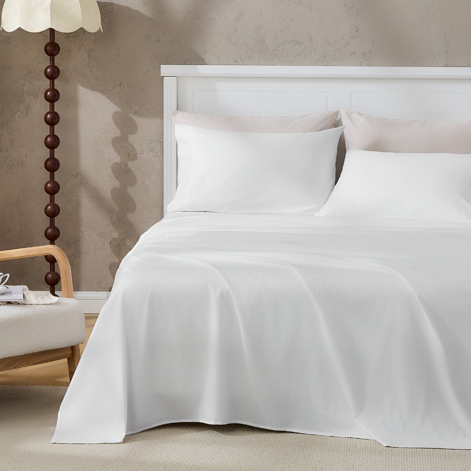Litanika 100% cotton percale sheet set in crisp, white bedding with smooth, tightly woven fabric for a comfortable sleep.