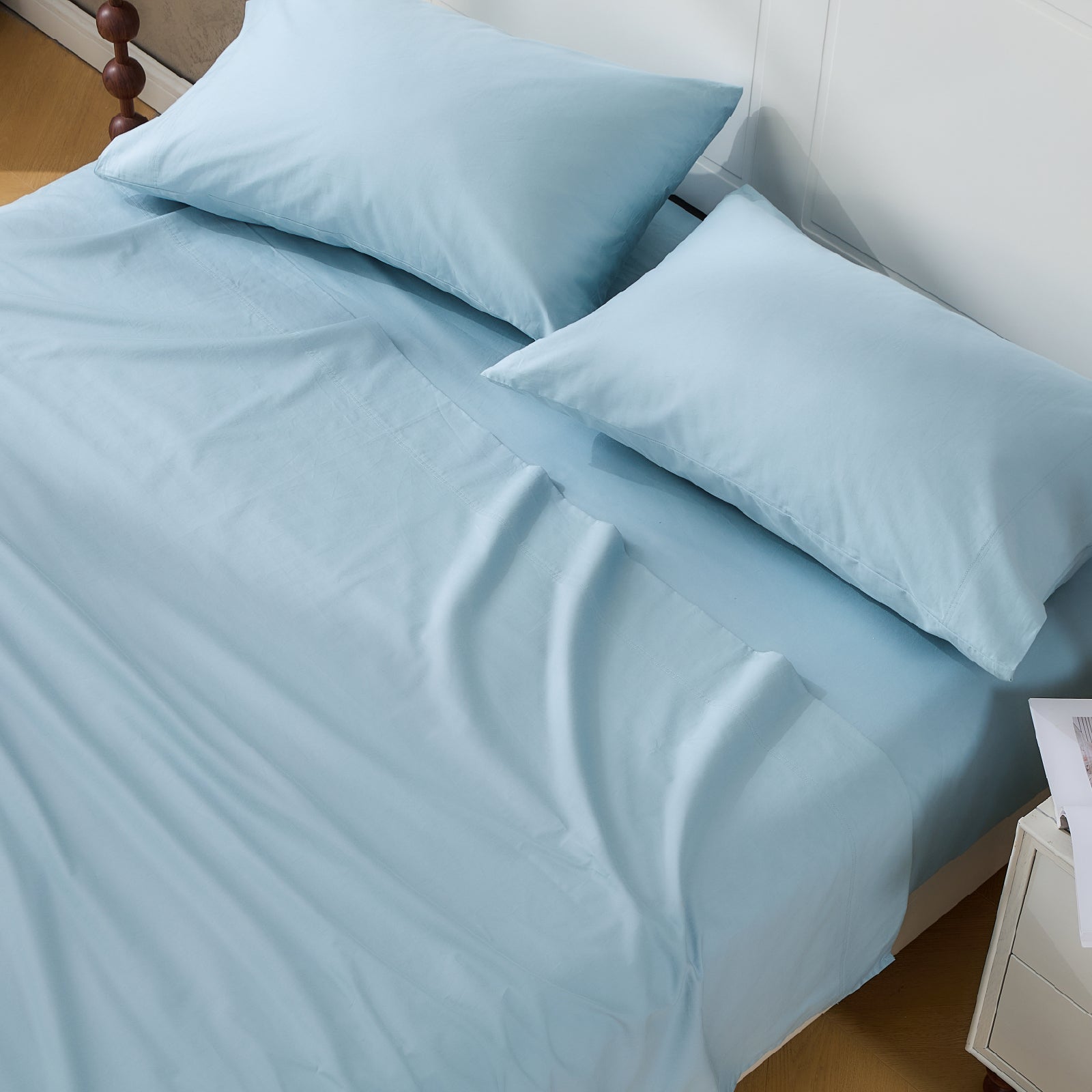 Litanika 100% cotton percale sheet set with smooth, crisp bedding in a neutral color, perfect for a cozy bedroom.