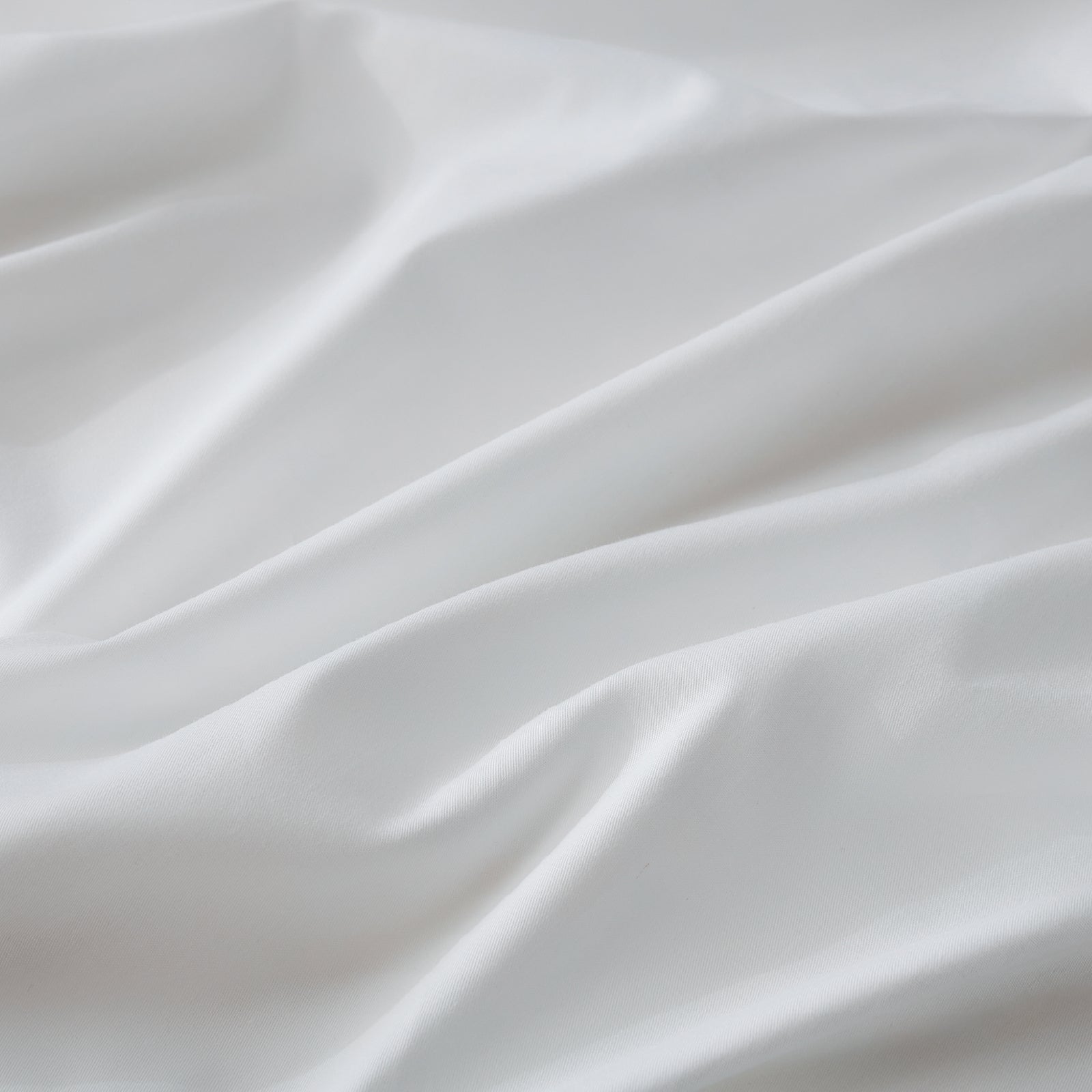 Litanika 100% cotton percale sheet set in crisp white, featuring smooth, tightly woven bedding for a comfortable sleep experience.