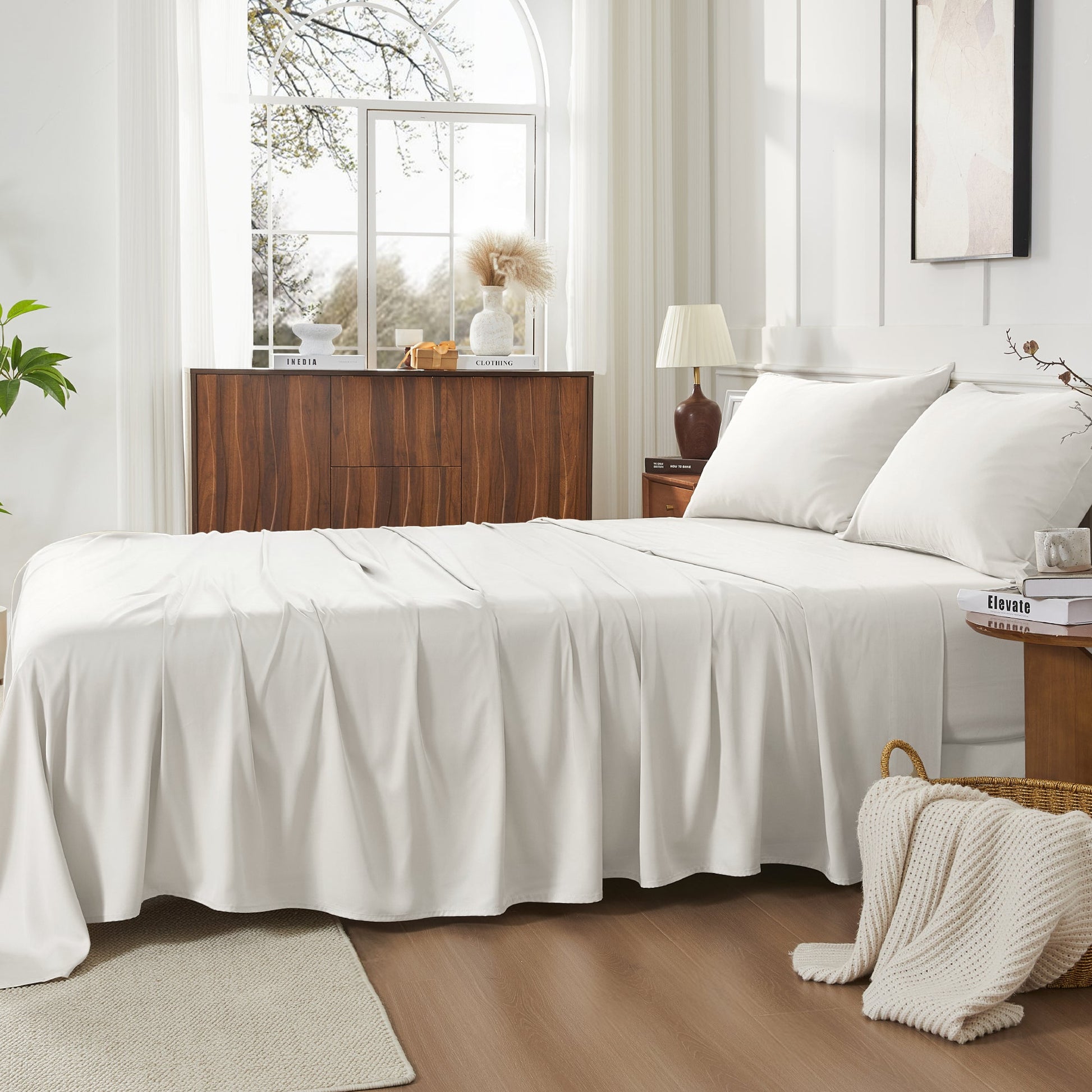 Litanika bamboo viscose silk-soft bedding sheets set with smooth, lightweight fabric laid out on a bed.