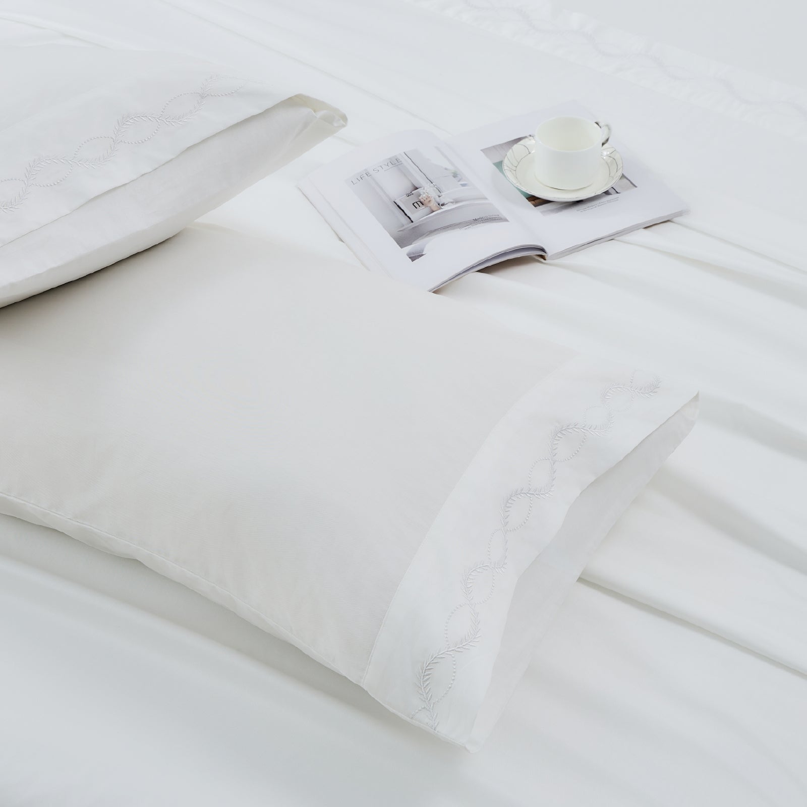 Litanika crisp percale organic cotton pillowcases featuring smooth, breathable fabric for comfortable bedding.
