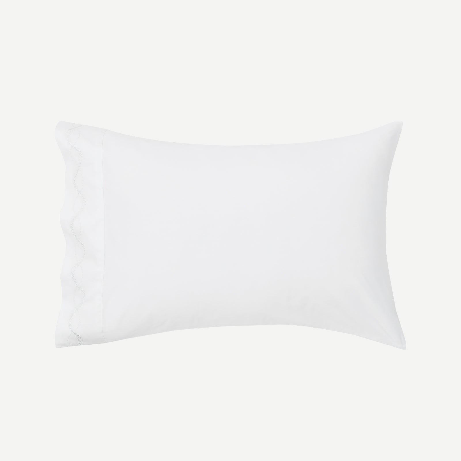 Set of crisp percale organic cotton pillowcases in white, showcasing smooth, breathable bedding by Litanika.