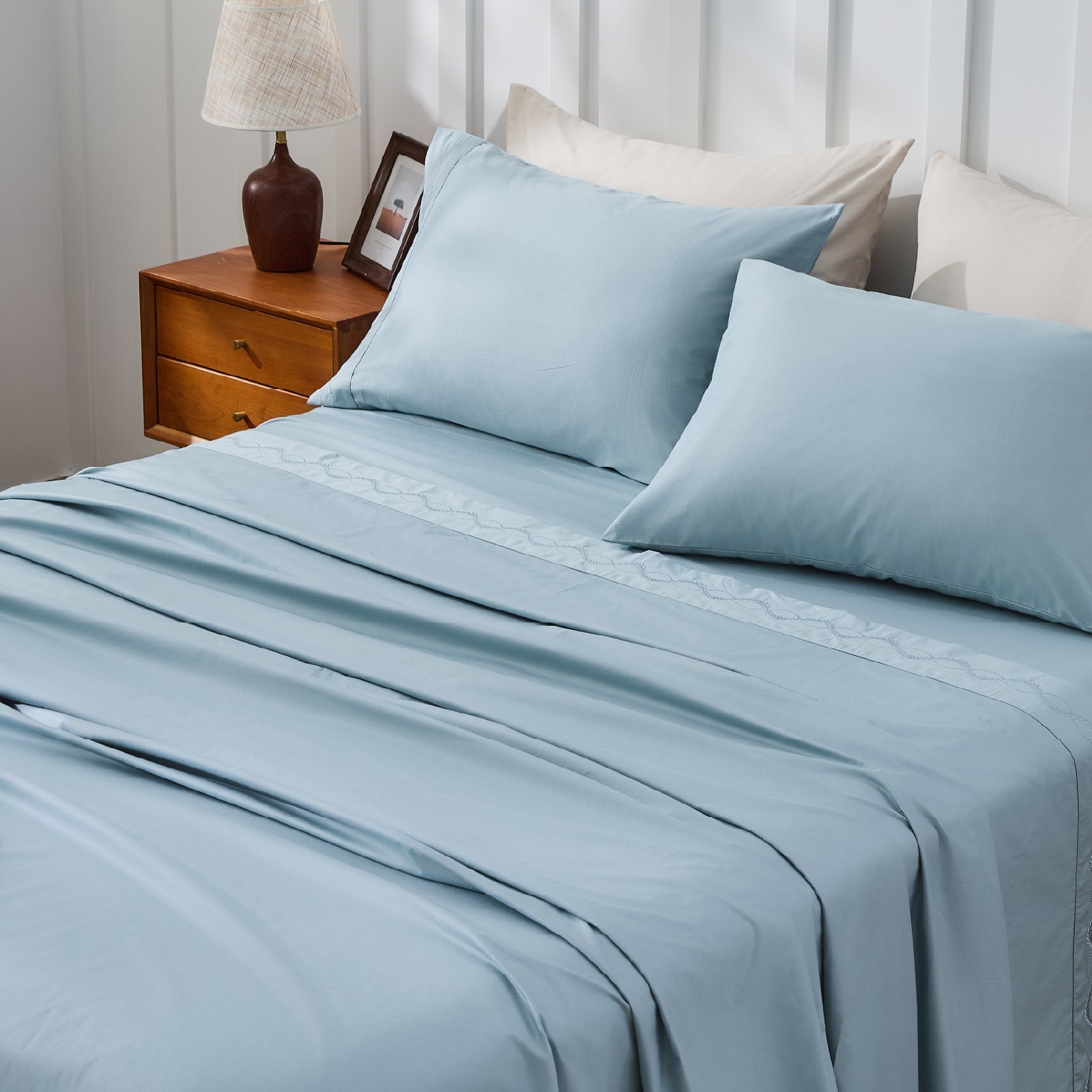 Crisp white Percale organic cotton pillowcases from Litanika, smooth bedding with a neat, freshly laundered look.