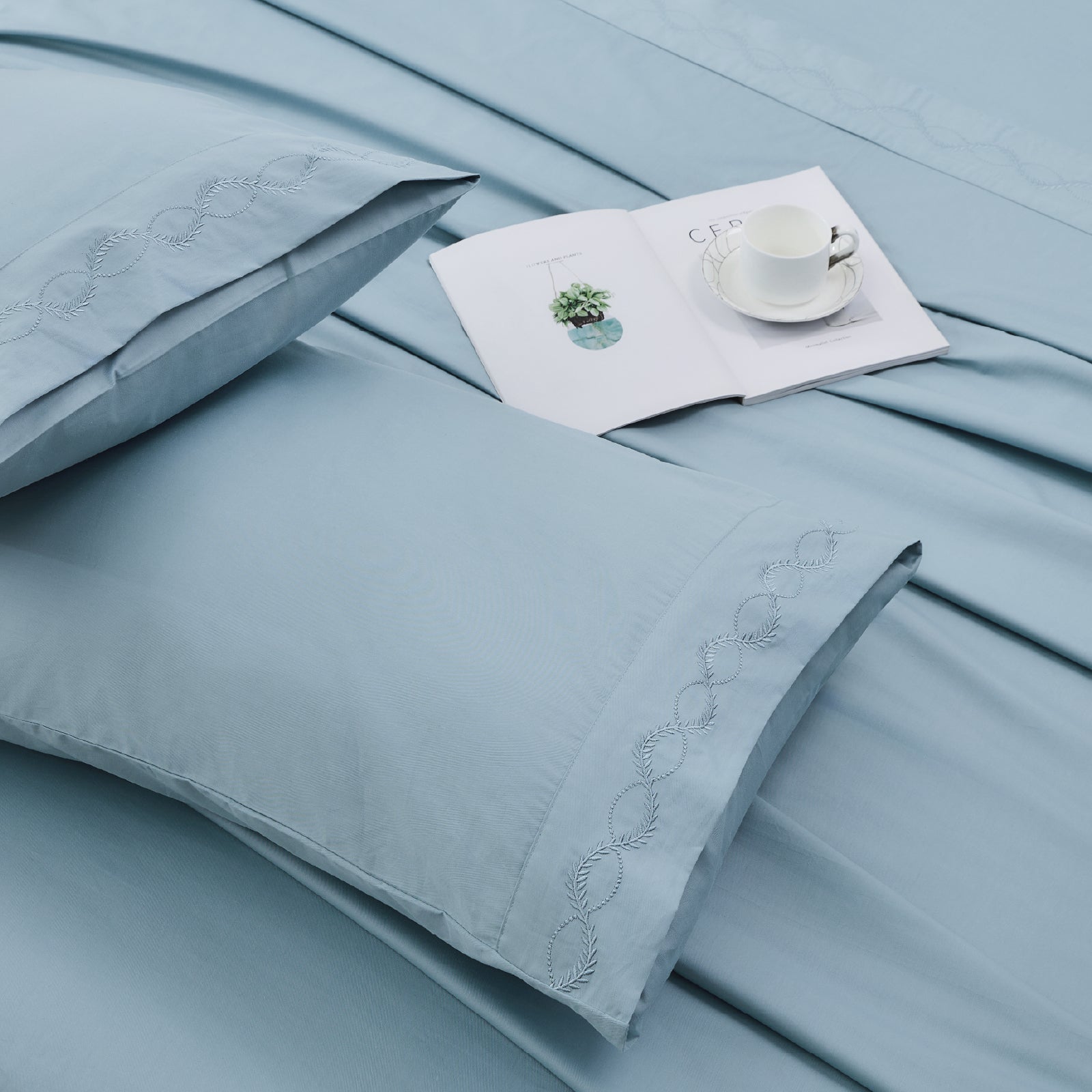 Set of crisp percale organic cotton pillowcases by Litanika, soft, breathable bedding with a smooth, clean finish.