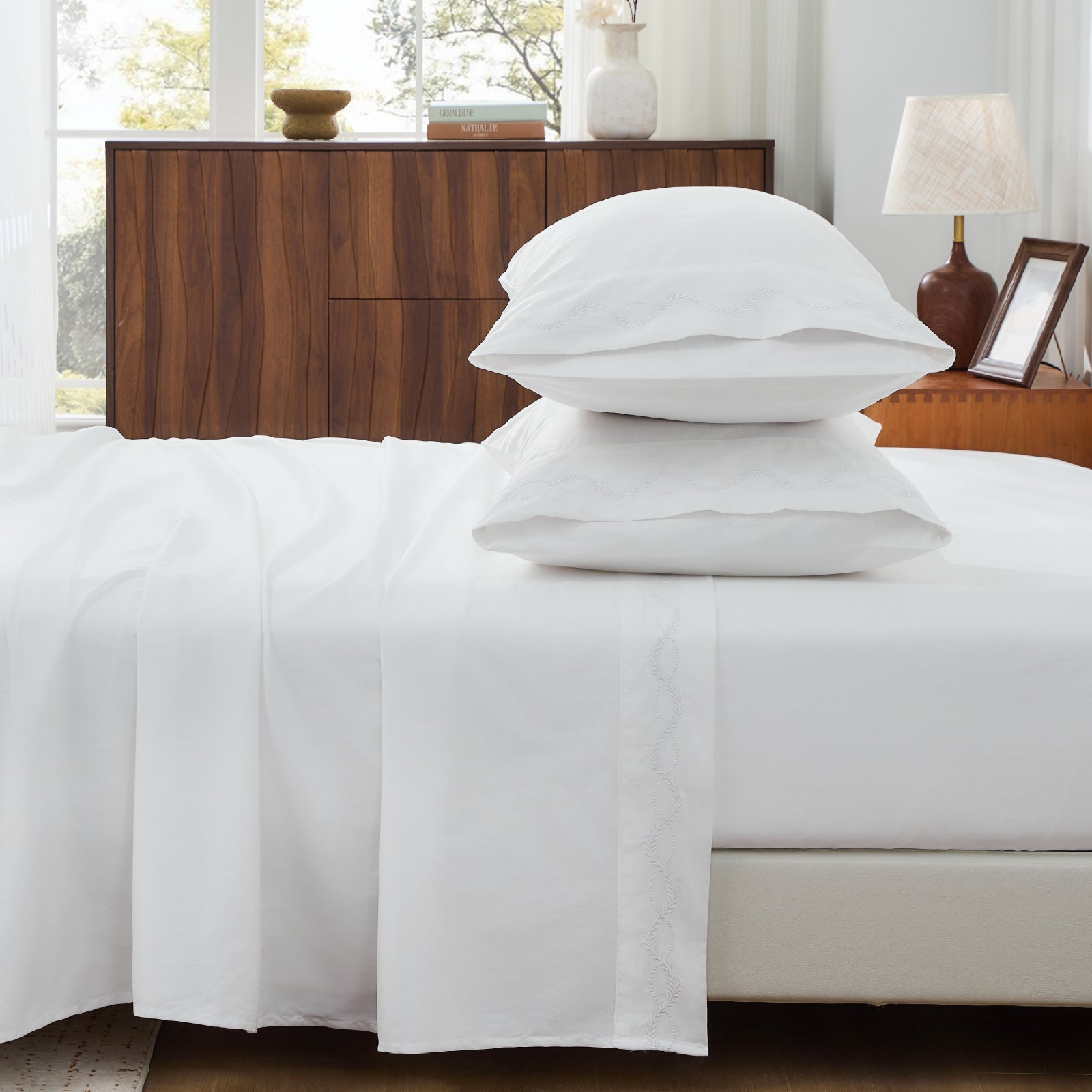Set of crisp percale organic cotton pillowcases from Litanika bedding collection, featuring smooth, breathable fabric and elegant design.