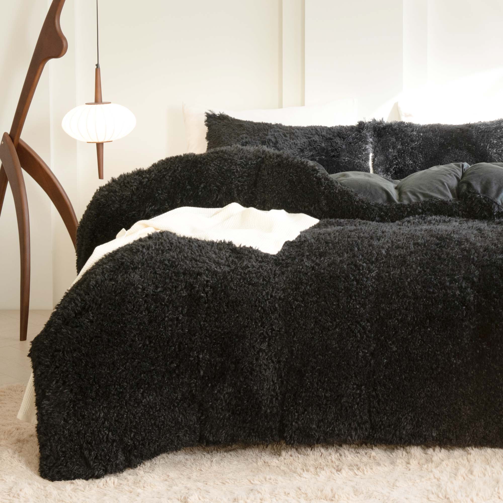 Litanika fluffy luxury shaggy plush velvet comforter set with three pieces in soft, warm texture on a cozy bed.