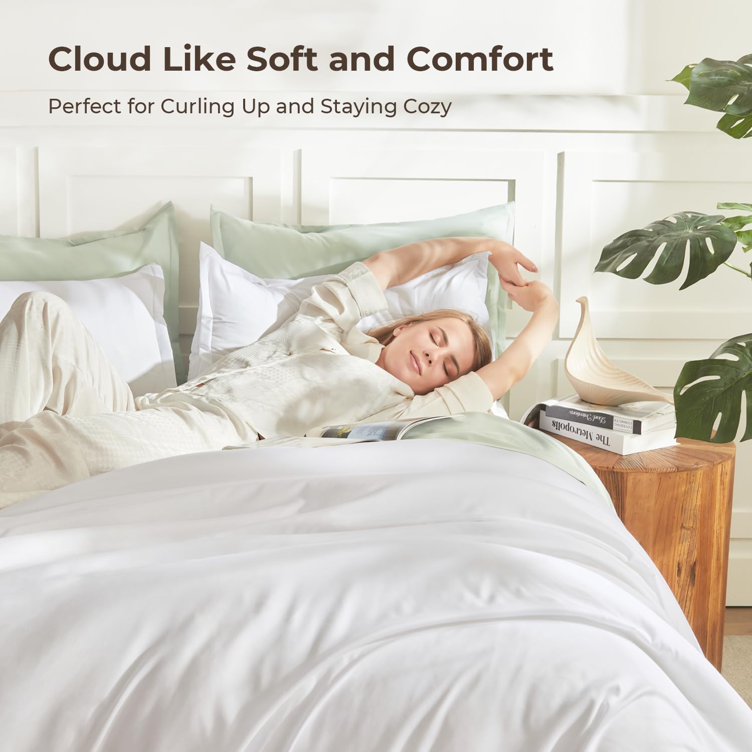 Litanika lightweight solid down alternative 3-piece comforter bedding set with matching pillow shams on a bed.