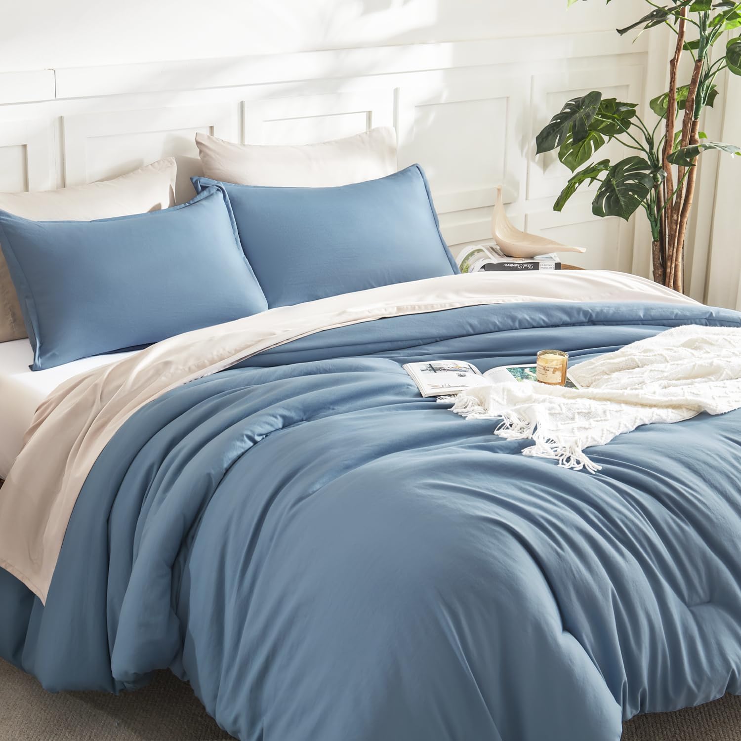 Litanika lightweight solid down alternative 3-piece comforter bedding set with matching pillow shams on a bed.