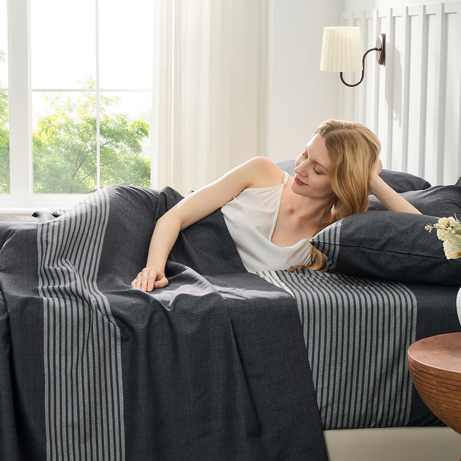 Litanika modern striped 4-piece bedding sheet set with blue and white stripes on a neatly made bed.