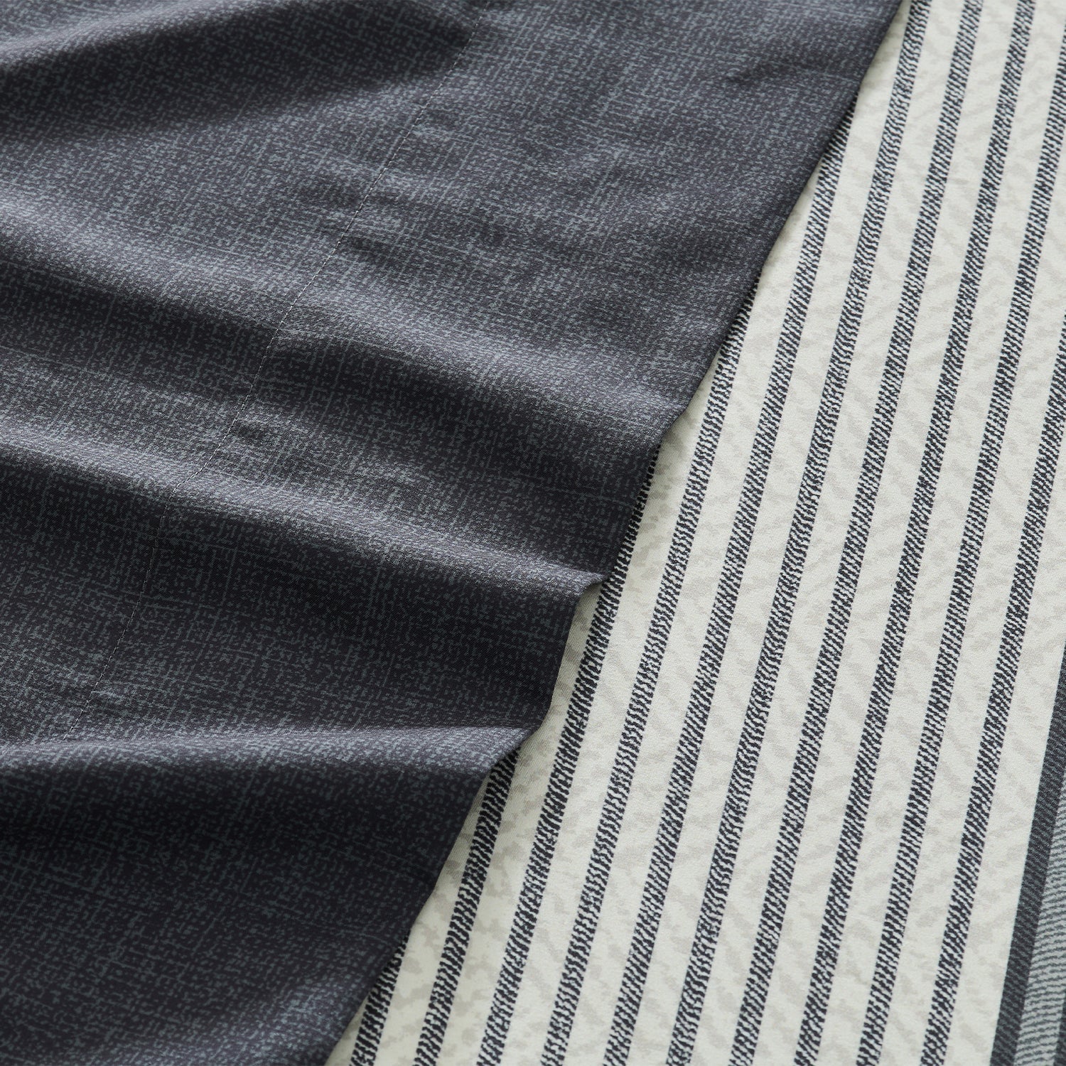 Litanika modern striped 4-piece sheet set with blue and white bedding, including fitted sheet, flat sheet, and pillowcases