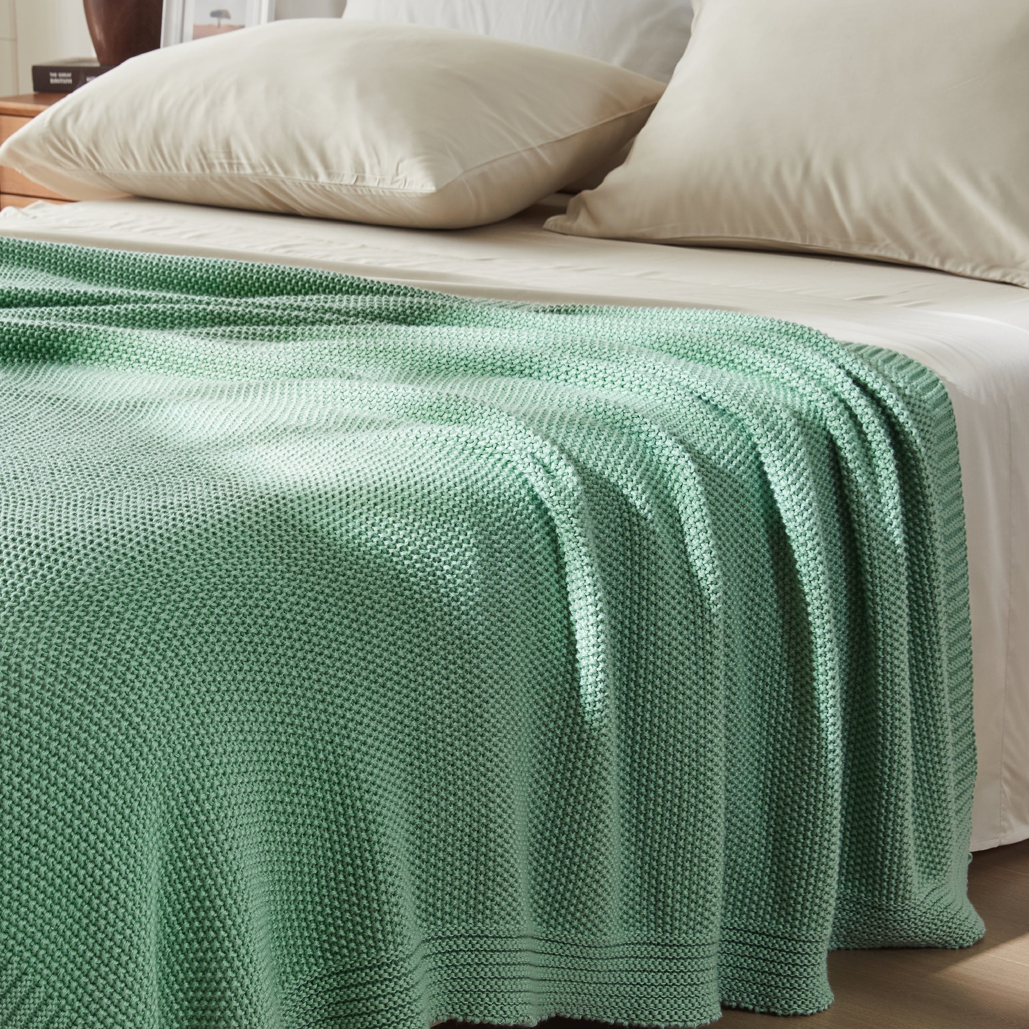 Litanika soft cozy cable knit throw blanket in neutral color, perfect for bedding or lounging.