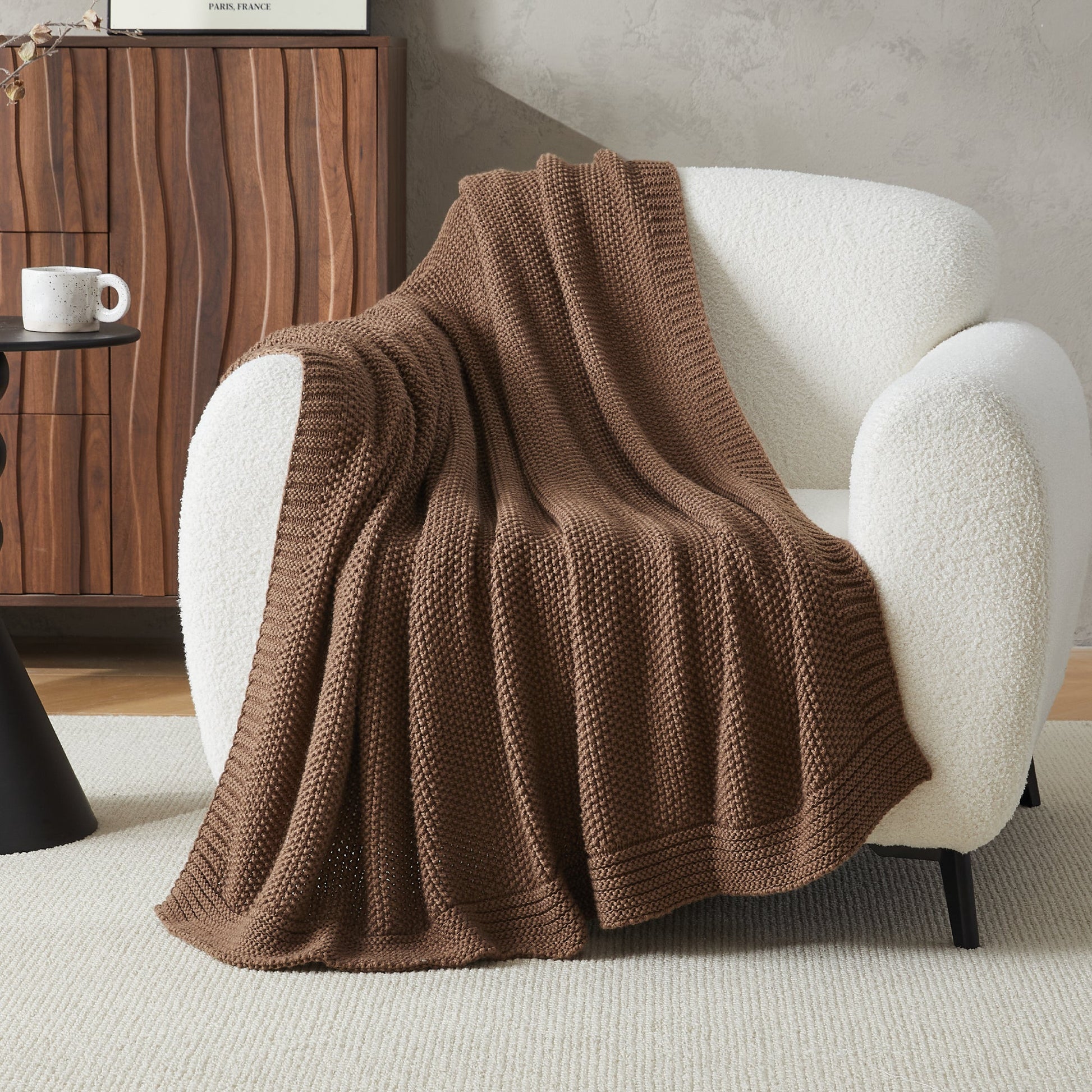 Soft cozy cable knit throw blanket by Litanika, displayed folded with textured knit pattern, ideal for bedding or cozy living spaces.