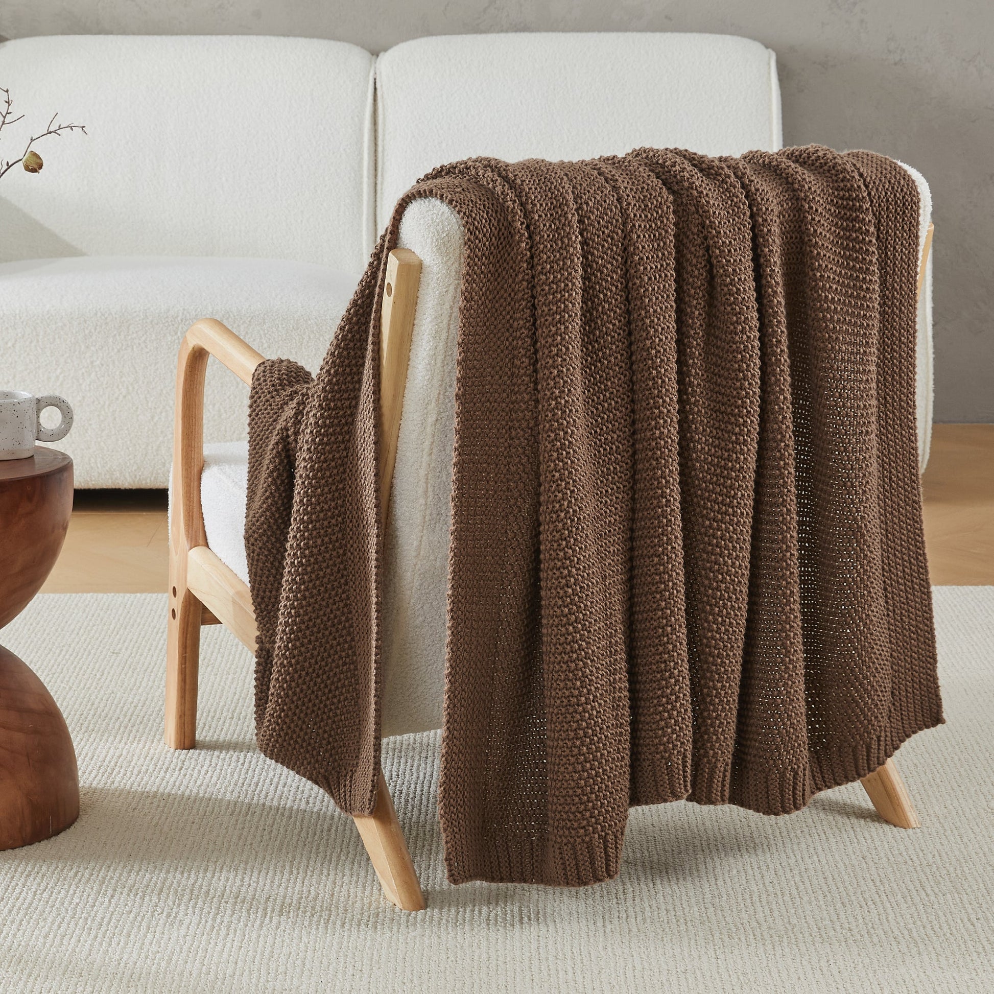 Soft cozy cable knit throw blanket by Litanika, featuring thick textured knit and plush fabric for warmth and comfort.