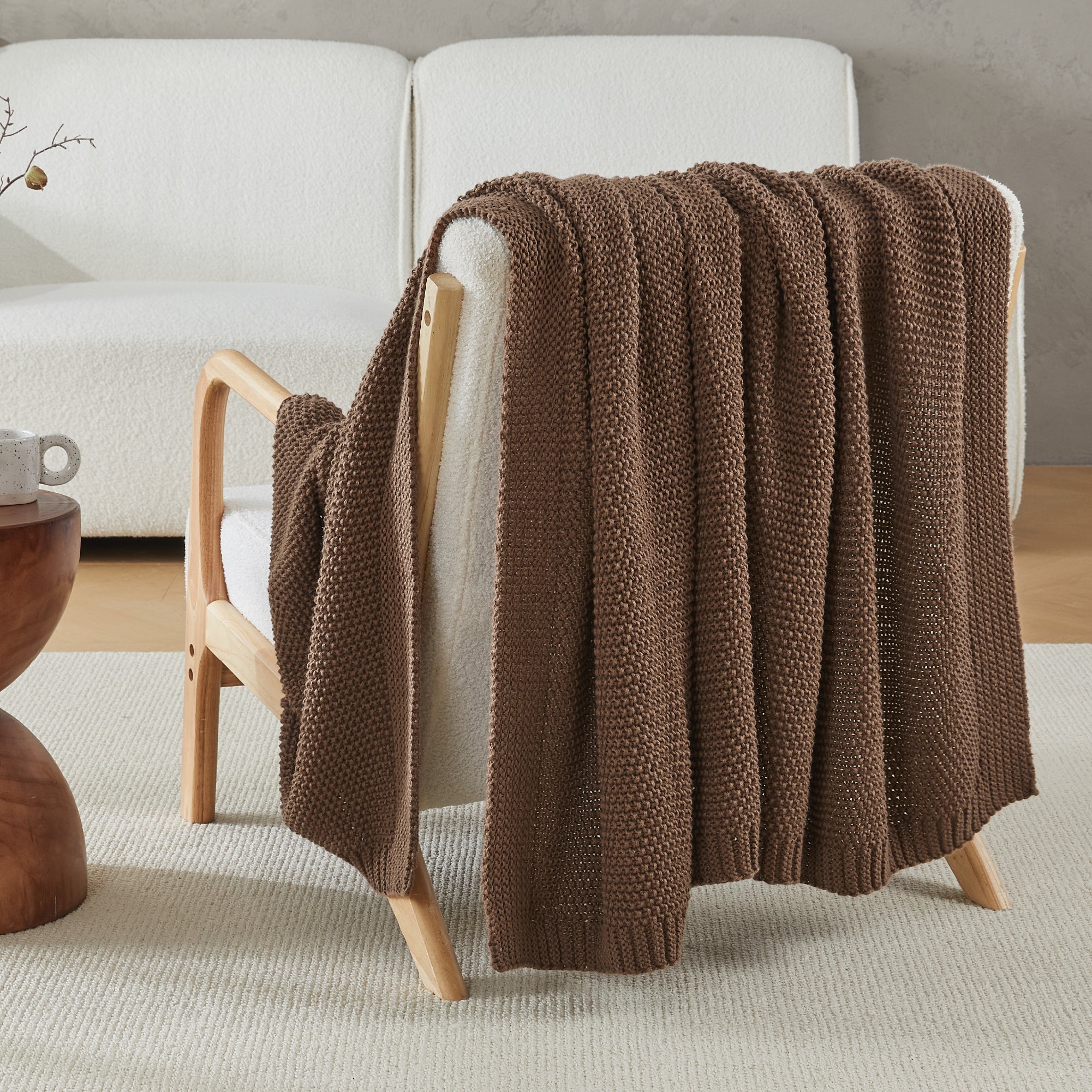 Soft cozy cable knit throw blanket by Litanika, featuring thick textured knit and plush fabric for warmth and comfort.