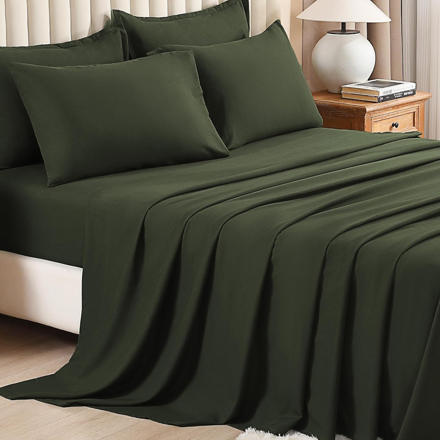 Litanika solid down 7-piece comforter bedding set with matching pillow shams and sheets, soft and plush for cozy sleep.