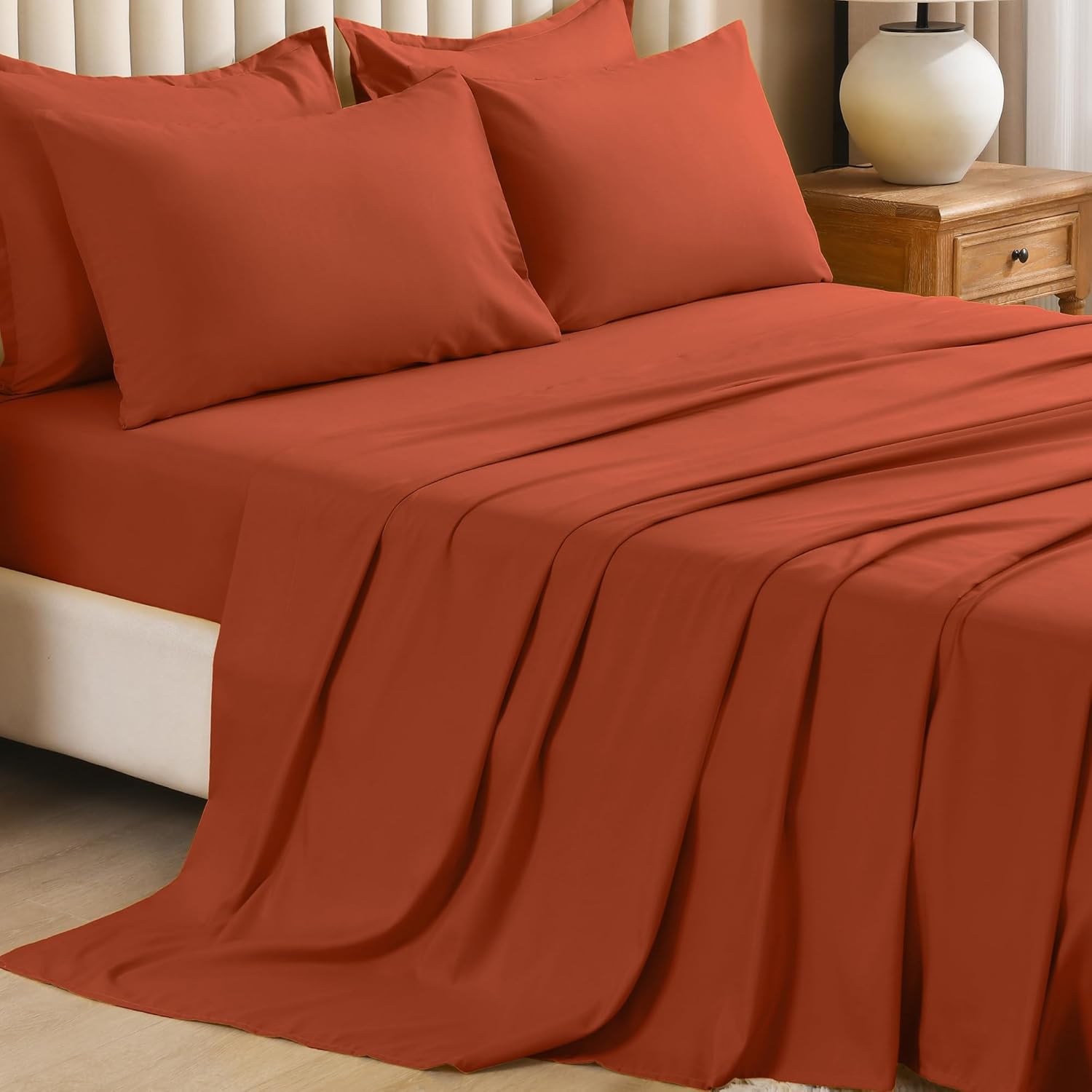 Litanika solid down 7-piece bedding comforter set with matching pillow shams and sheets in a cozy, plush fabric.