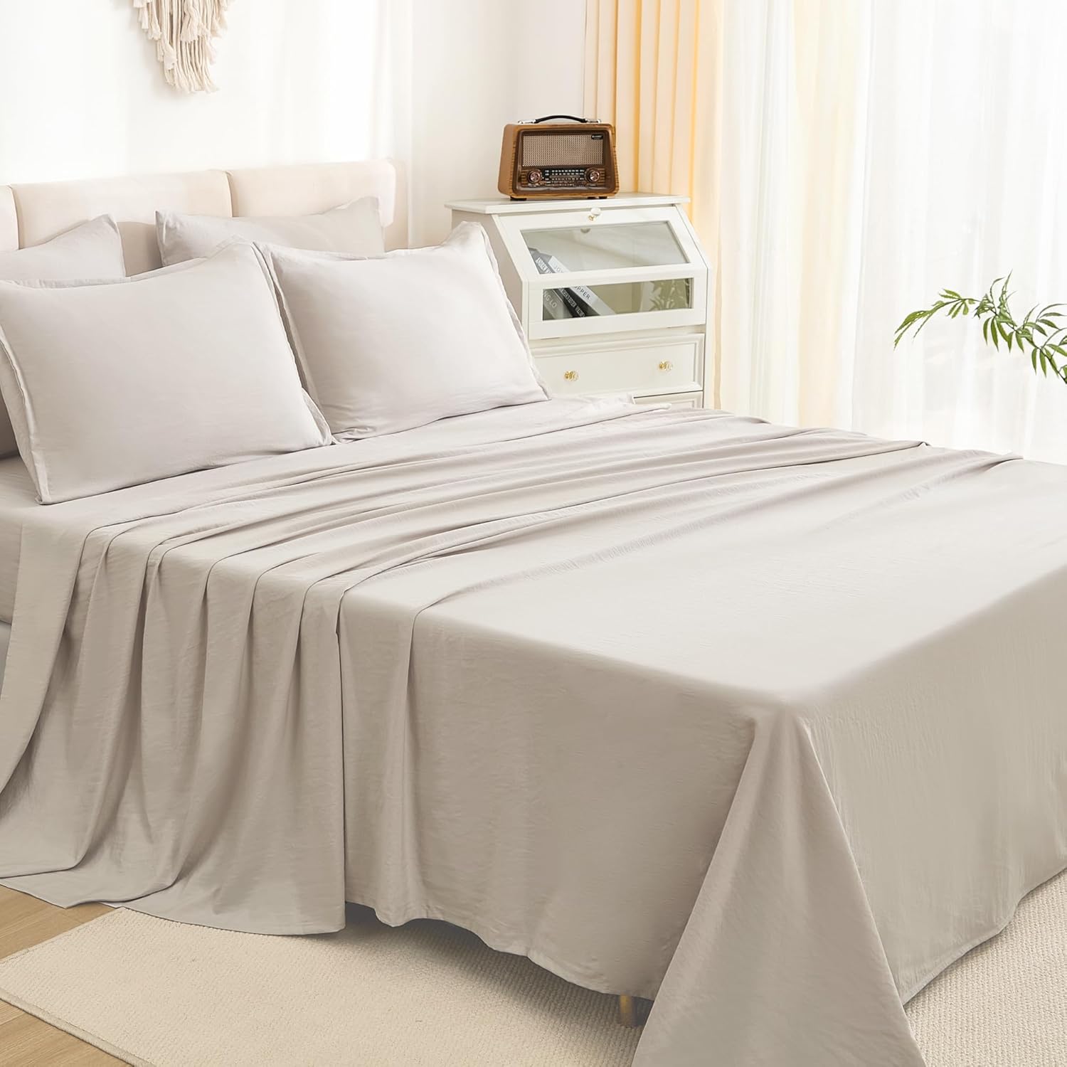 Litanika solid down 7-piece bedding comforter set with matching pillow shams and sheets in a cozy, plush design.