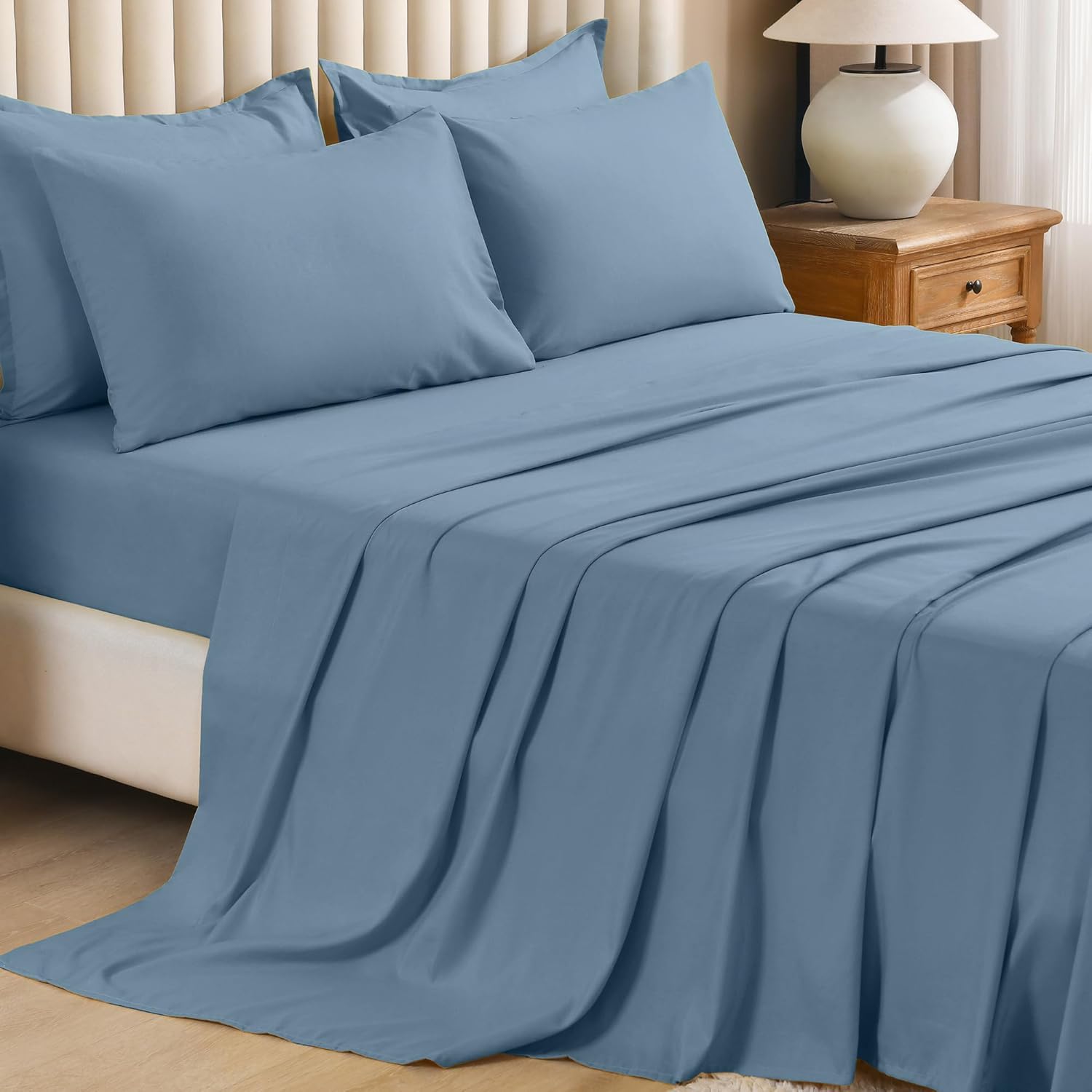 Litanika solid down 7-piece comforter bedding set with matching pillow shams and sheets, soft and cozy for a comfortable sleep.