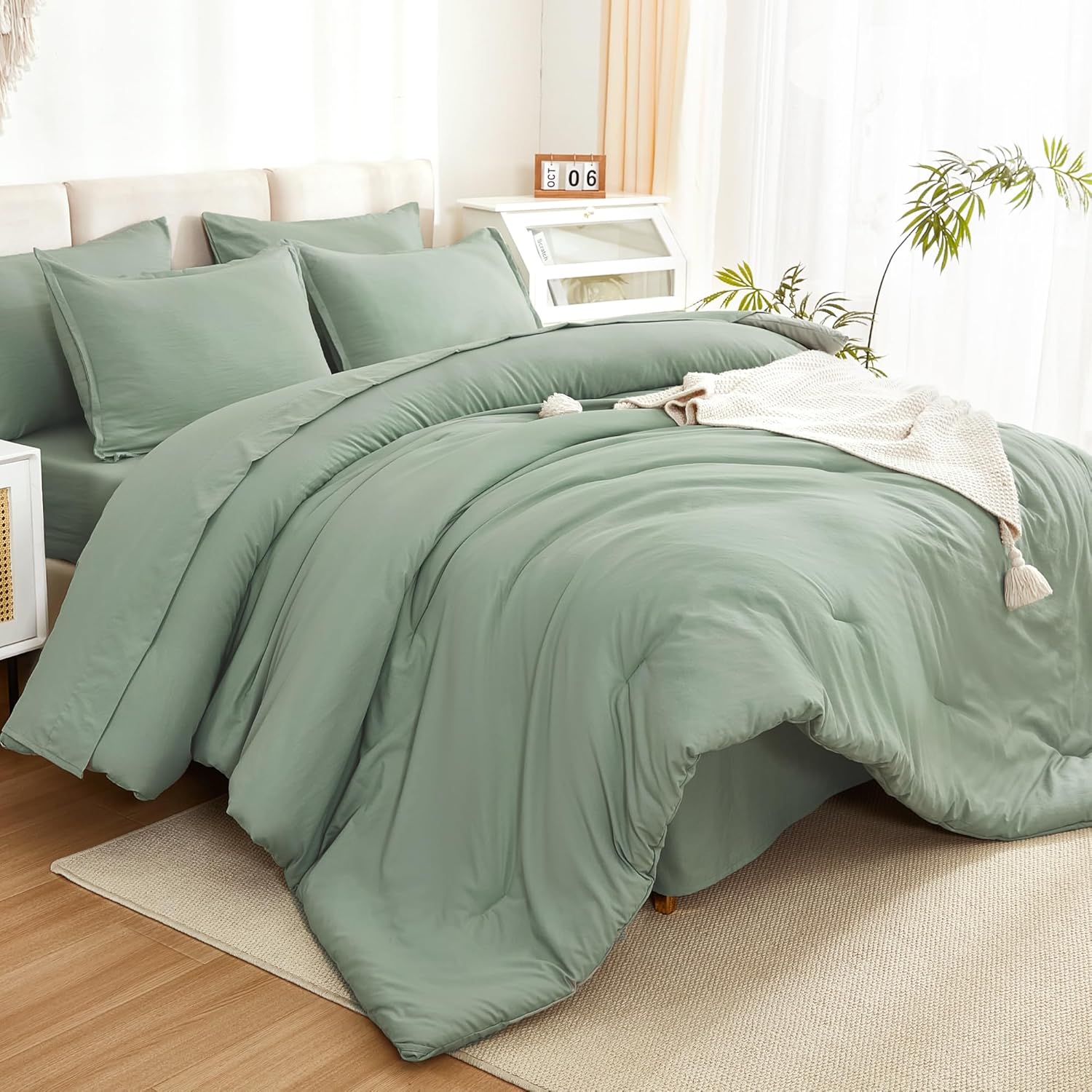 Litanika solid sage green twin size 7-piece down comforter bedding set with pillow shams and sheets.